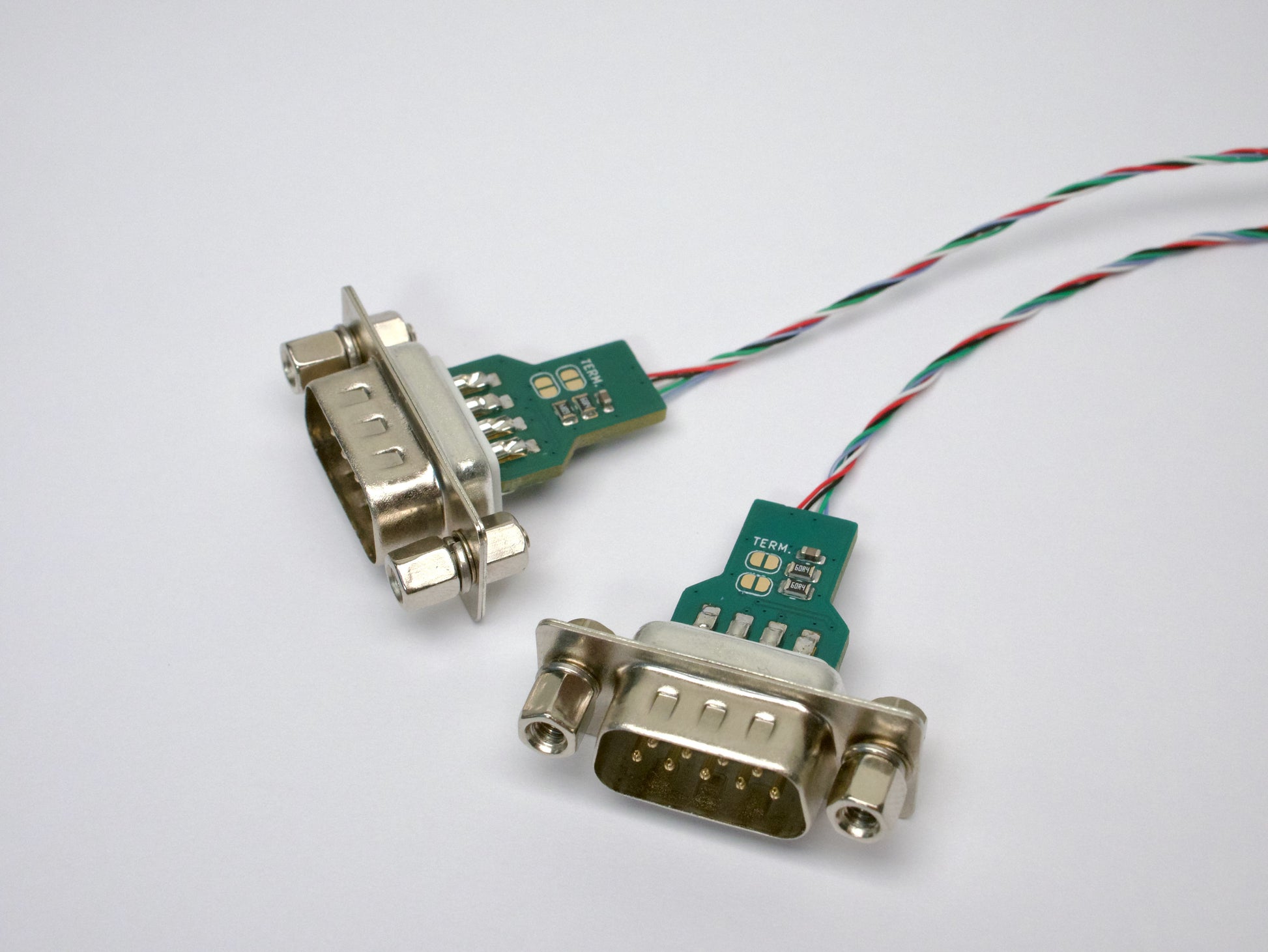 Closeup picture of two DB9 breakout connectors.