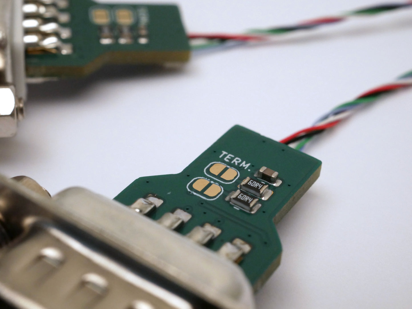 Closeup photo showing the termination jumpers on a DB9 breakout connector.